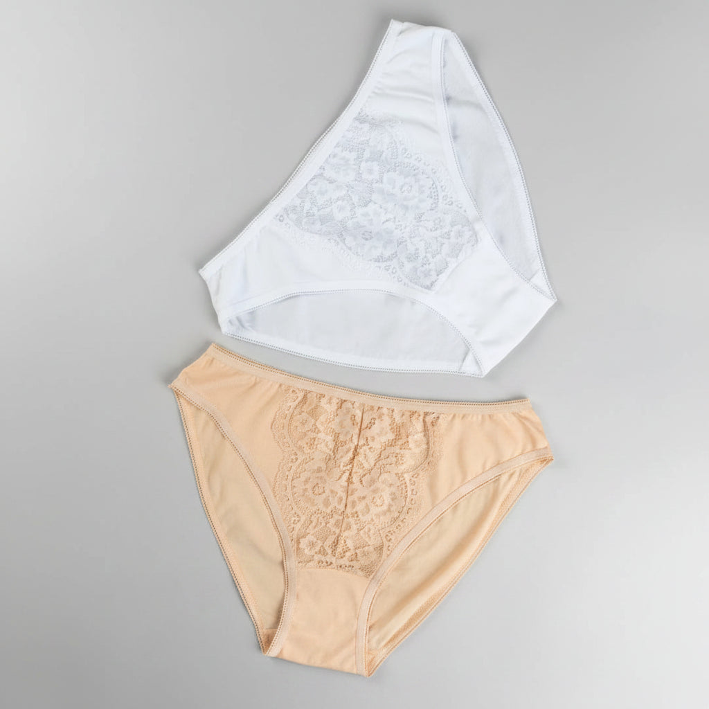 Beige and white lace-trimmed underwear on a brown background